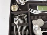a box with silverware in it on a table