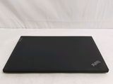 the back of a black laptop computer sitting on top of a white surface