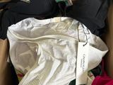 a cardboard box filled with underwear and a bra
