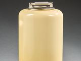 an image of a yellow glass lamp with a metal base