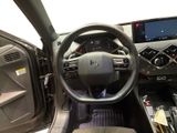 the interior of a car with a steering wheel and a dash board