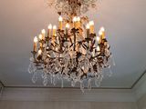 a chandelier that is hanging from the ceiling in the room