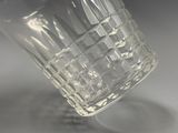 a close up of a glass of water on a table