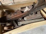 a box full of wood pieces and a hammer in it