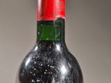 a bottle of wine that is sitting on a table