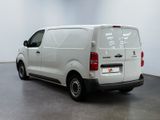 a picture of a white van parked in a room