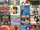 beaucoup de pochettes d'albums différentes sur le mur