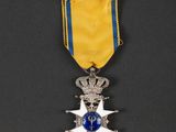 a medal with a star on it sitting on top of a table