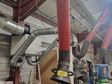 many pipes that are hanging from the ceiling of a building