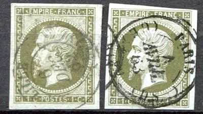 a couple of stamps that are sitting on top of a table