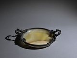 a picture of a piece of jewelry that is sitting on a table