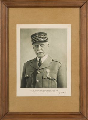 an old photo of a man in a military uniform in a frame
