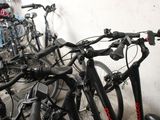 a lot of bikes that are lined up in a room