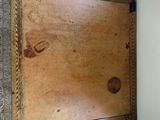 a wooden table with a drawer on top of it