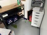 an image of a small room with a computer and a printer