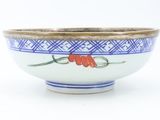 a white bowl with blue and red designs on it