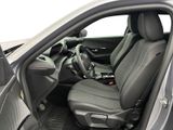 the interior of a car with the door open and the driver ' s seat down