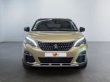 the front view of a beige peugeot v - cross parked in a white room