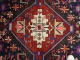 a person standing in front of a rug on the floor