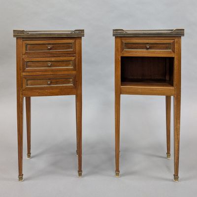 pair of french bedside tables with marble tops