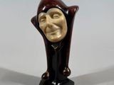 an image of a statue of a man with a smile on his face
