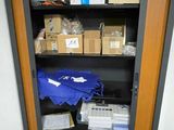 a cabinet with many items in it in a room