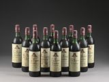 six bottles of wine are lined up in a row on a table