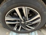 the tire of a car with a flat tire on the ground