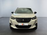 the front view of a white car in a showroom