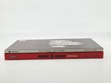 two books are stacked on top of each other on a white surface