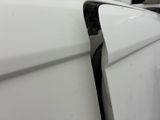 a black cat sitting on top of a white car
