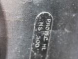 a close up of a metal object with a tag on it
