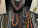 various necklaces and bracelets displayed on display on a table