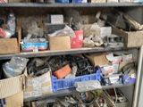 shelves filled with assorted items and tools in a room
