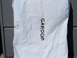 a white bag that is sitting on the ground