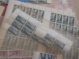 a pile of stamps sitting on top of a table