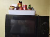 a microwave sitting on top of a counter in a kitchen