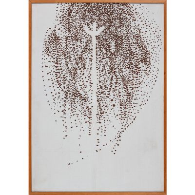 une photo encadrée représentant un arbre, composée de minuscules points marron
