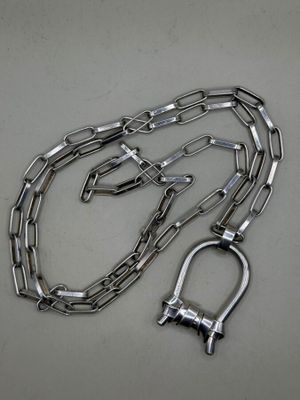 a close up of a metal chain with a shack on it