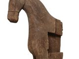 an old wooden toy horse with a long neck and legs