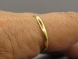a close up of a person ' s hand with a ring on it