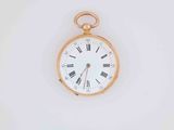 a gold pocket watch with roman numerals on the face