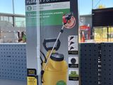 the box of a yellow sprayer is sitting on a table