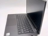 a laptop that is sitting on a white table