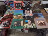 a lot of records on a table in a room
