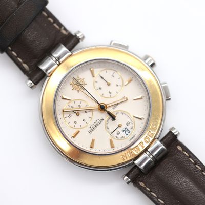 an image of a close up of a watch on a white surface