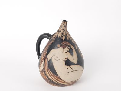 a black and white vase with a nude woman on it