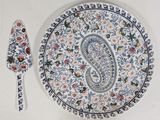 a plate with a spoon and a spoon rest on it