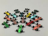 a lot of toy cars that are on a table
