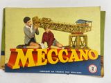 a book with a picture of a man and a boy playing with a model of a crane